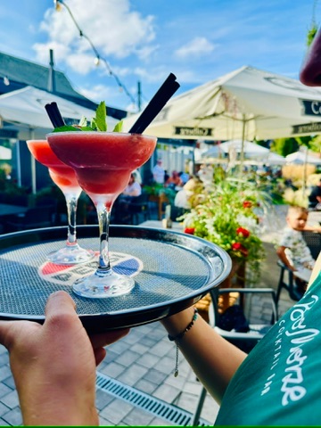 Two watermelon daiquiris on a tray — with the #BoMorze apron
