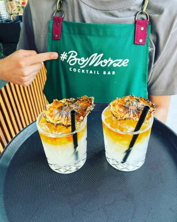 Two Pina Coladas on a tray — #BoMorze · Cocktail Bar apron
