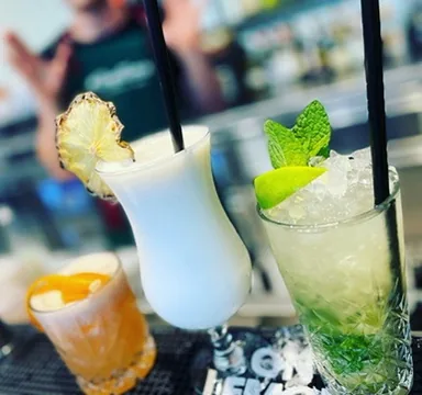 Pina Colada and Mojito side by side — white and green classics