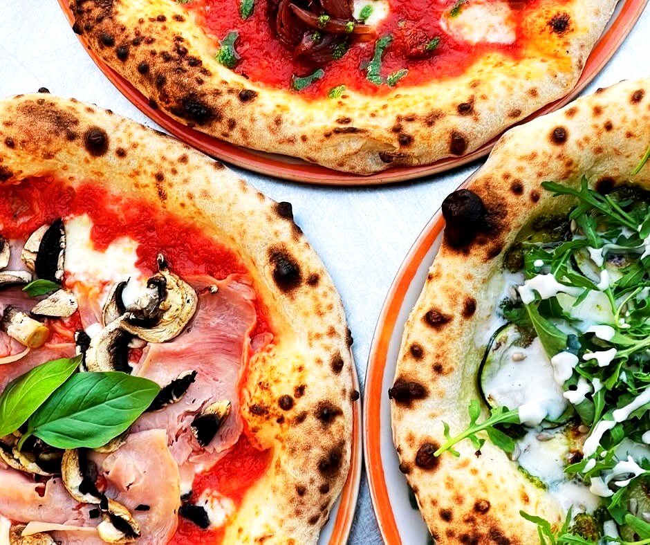 Three BoMorze Neapolitan pizzas from above — cornicione with leoparding